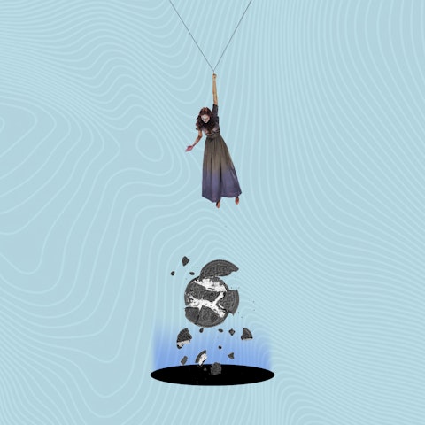 woman hanging from a chain above a crumbling cooking falling into a black hole