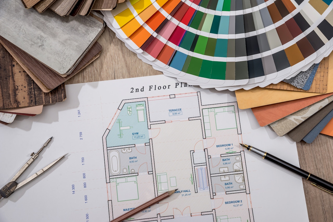 home plans with a collection of color and material samples