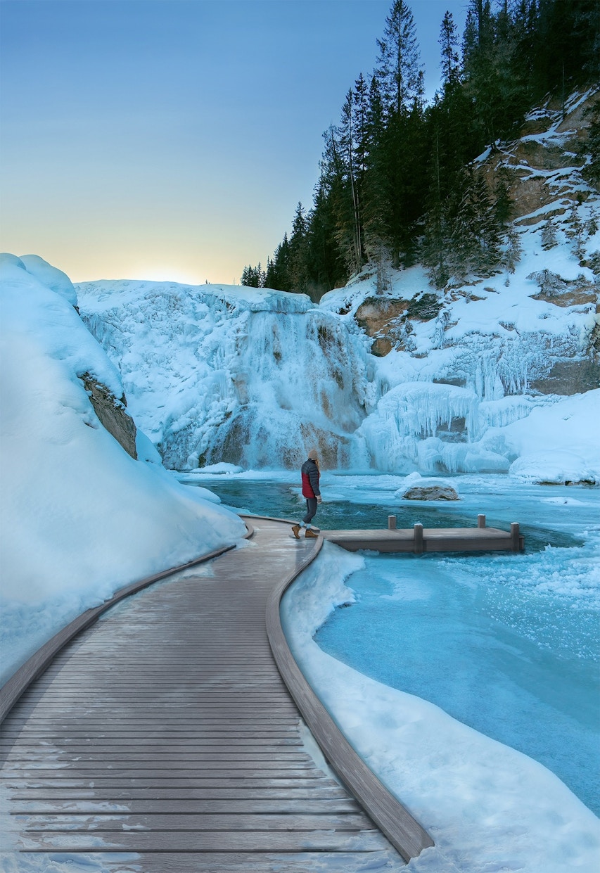 Man standing on a snowy MoistureShield dock with a deck leading up to it