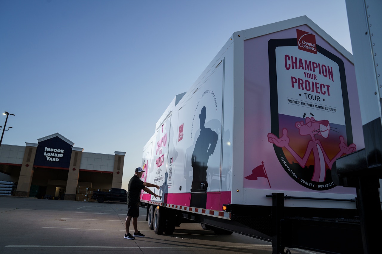 Owens Corning Insulation road show trailer sitting in a parking lot