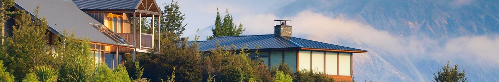 Exterior of two houses sitting on a hill